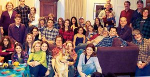 Group of people with their dog.