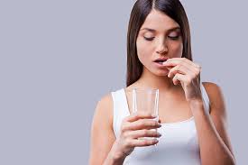 Woman taking the The morning-after pill